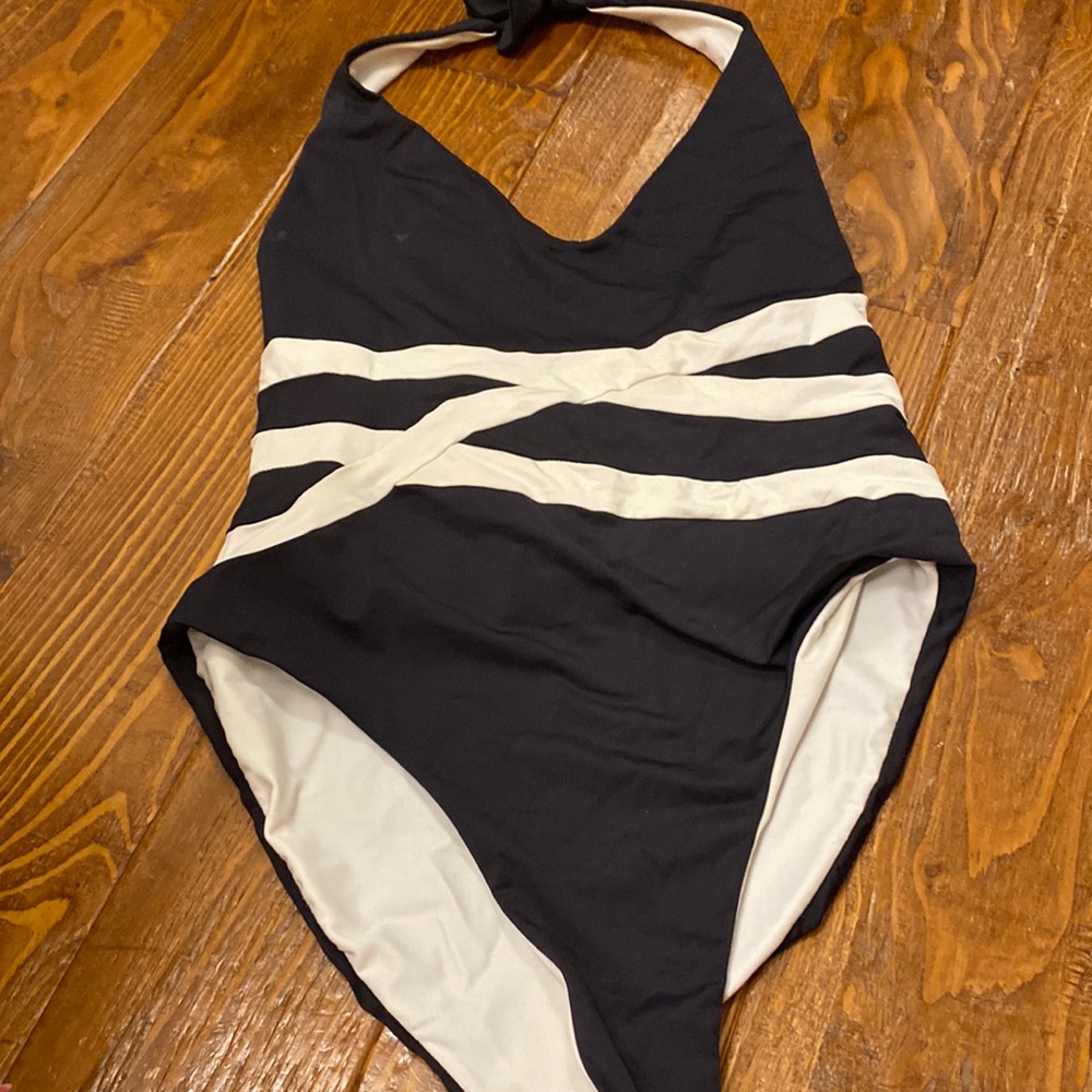 One piece ties around neck. High back